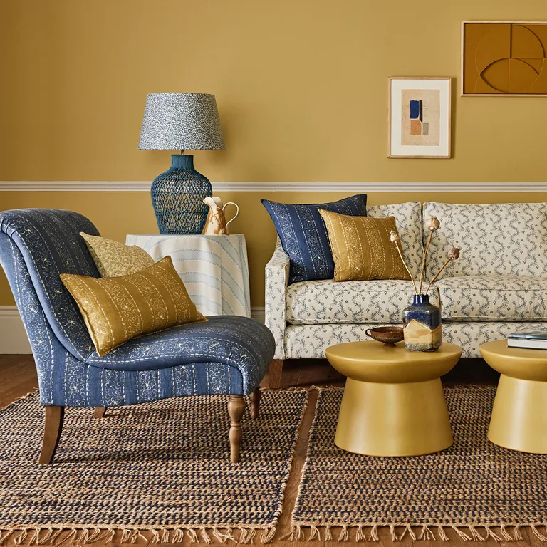 Armchair in Fortune Teller and sofa in Magic Lantern fabric by Linwood