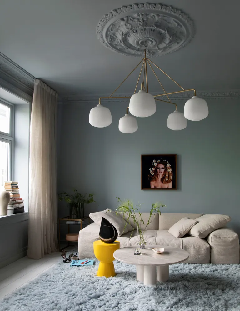 A living room with a large chandelier