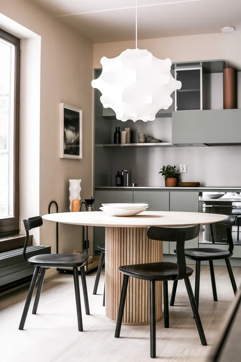 A dining room in mid tone grey and pink